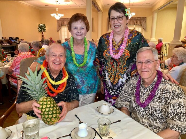 Group of seniors at a social luau.