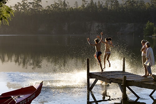 Kids jumping off dock at Beaver Dam in Cockeysville near a retirement community.
