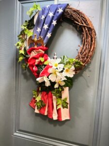 Door wreath using an American flag created by a floral design maestro.