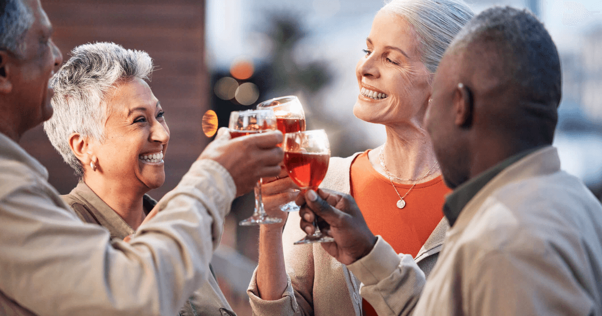 Group of friends making a toast Active Adult Retirement Living: What it Is and Why it Could Be Right for You