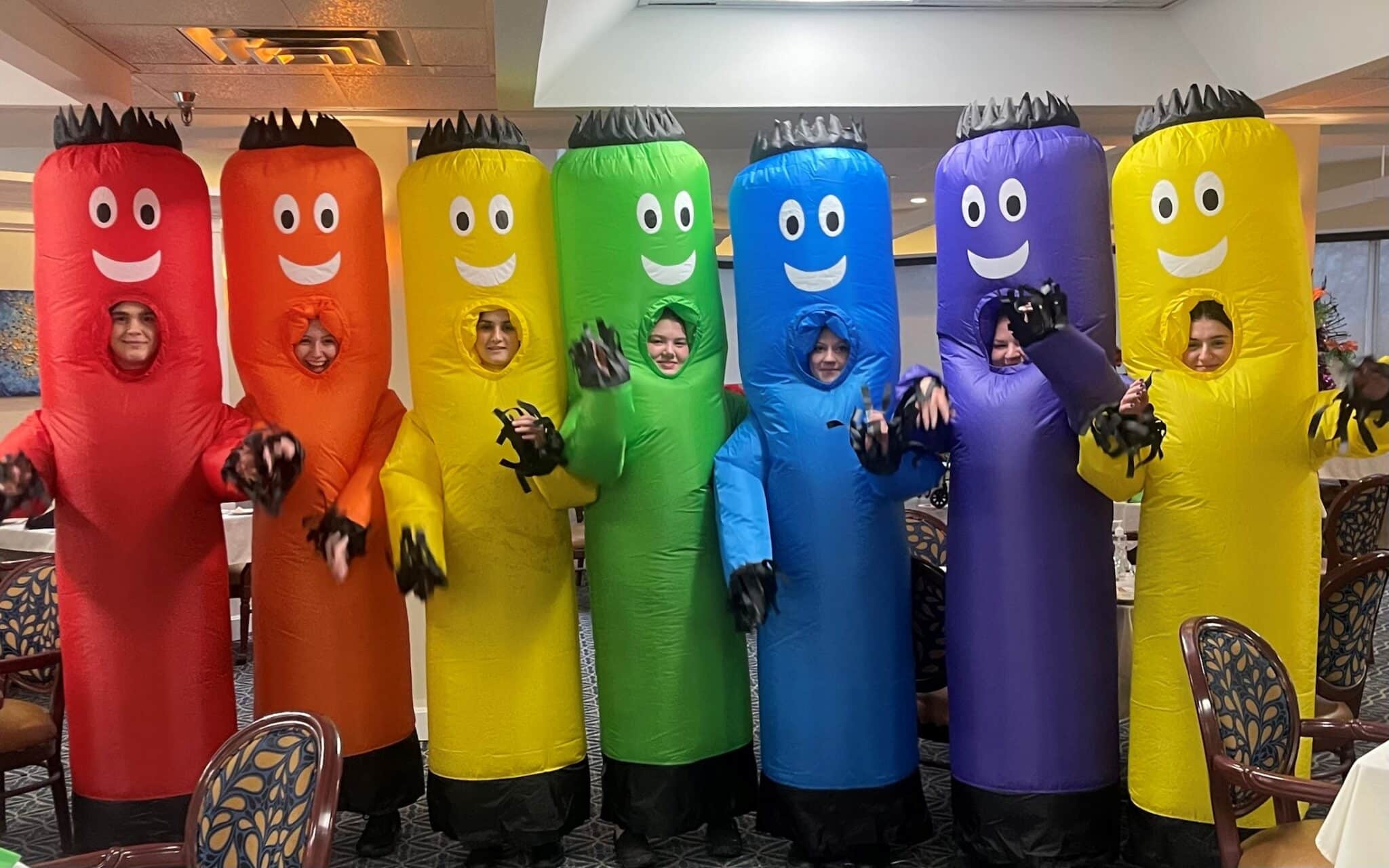 employees in fun colorful costumes