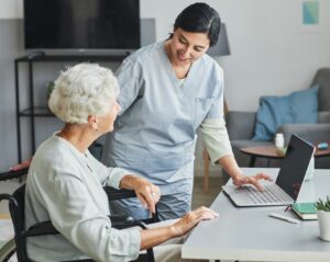 Nurse Assisting Senior Woman