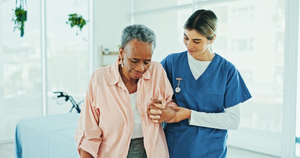 Physiotherapist, helping and senior care for old woman, clinic and walking for rehabilitation and s