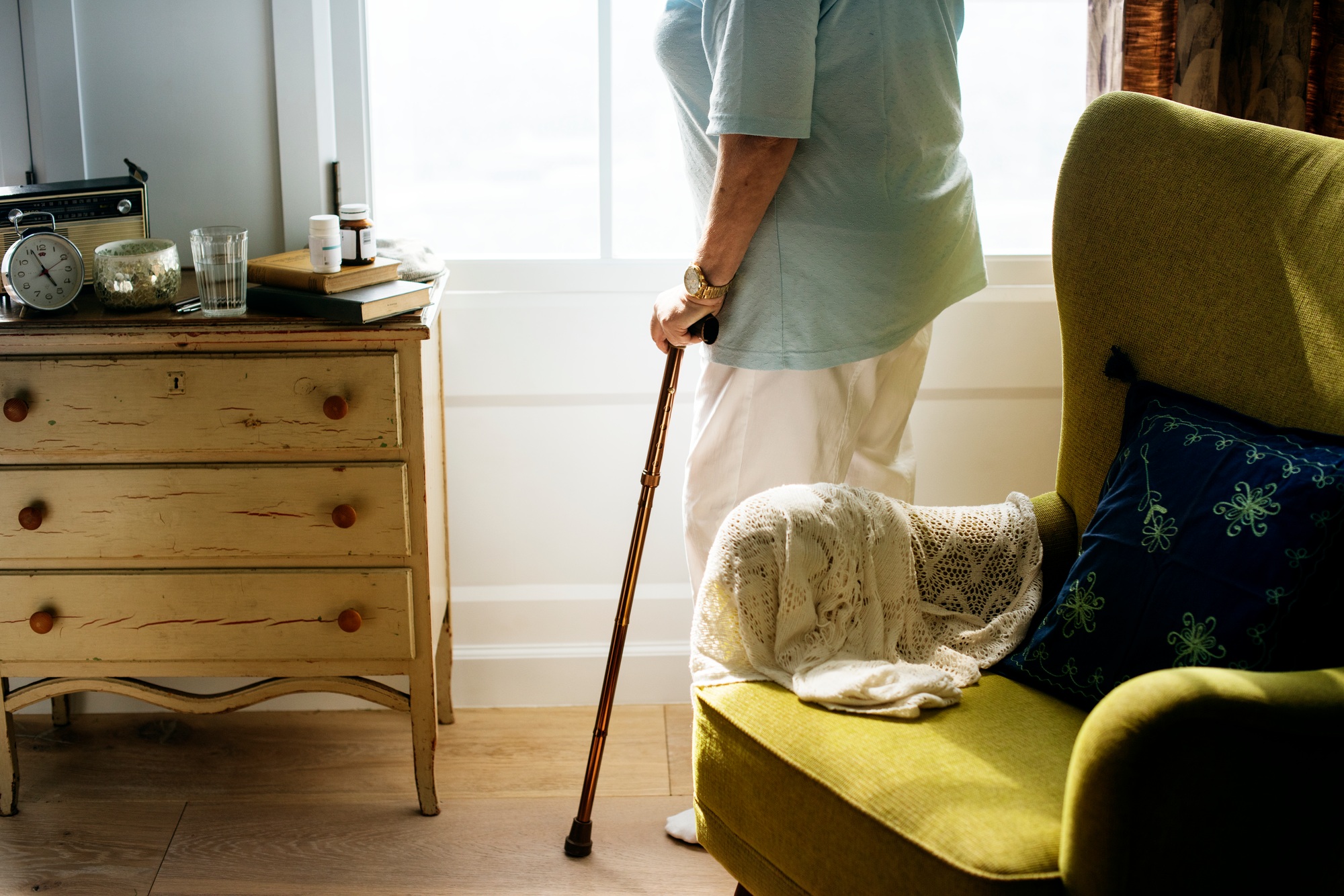 Senior woman standing alone in the room