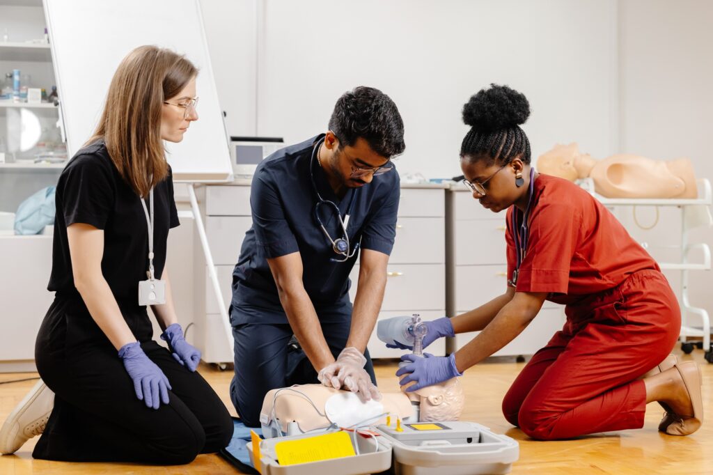 Medical Professionals Practicing CPR on a Training Dummy