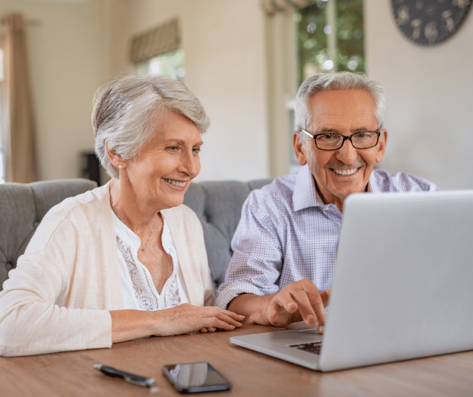 Senior couple looking at laptop for a senior living community in Westminster, MD
