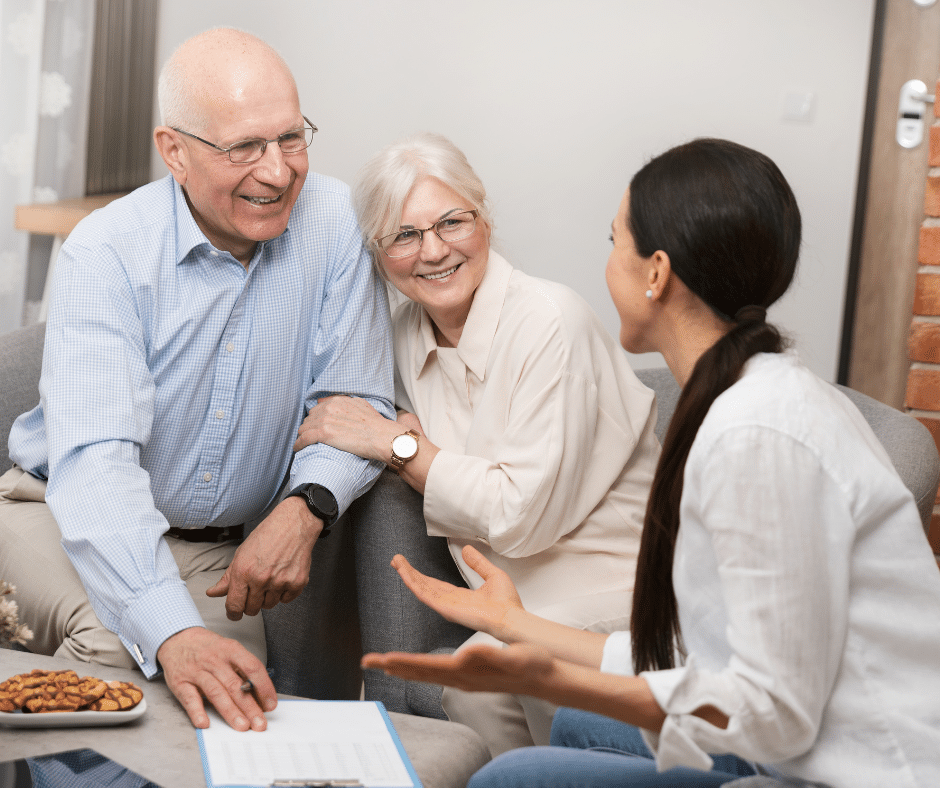 happy older adult couple meeting with a financial advisor to help their financial confidence